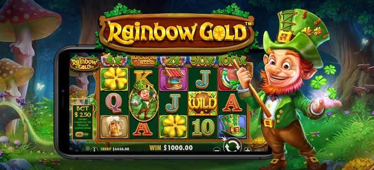Rainbow Gold key art by Pragmatic Play: the leprechaun beside a phone showing the five reels, under the game logo in an enchanted forest
